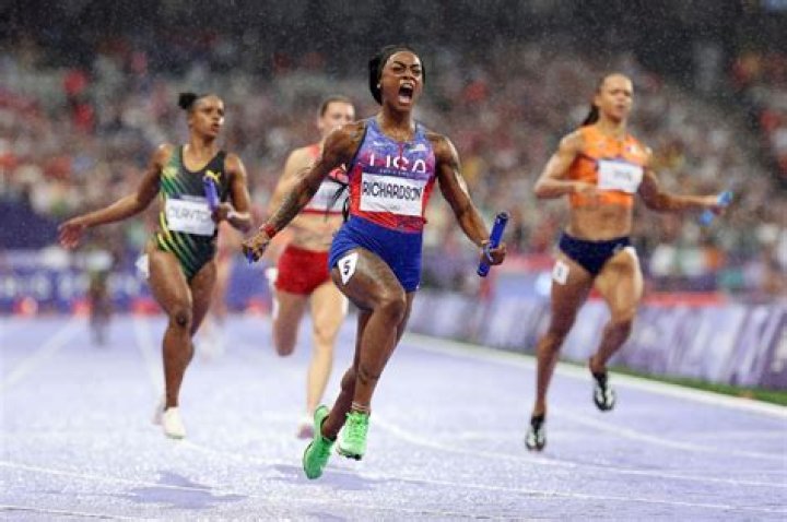 Sprinter Sha'Carri Richardson Celebrates Her 100 Meters Win with Warm